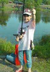 Fishergirl Shows Her Fish to the Camera